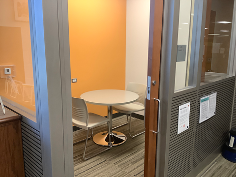 Photo of Study Room 1, with a small round table and two chairs.