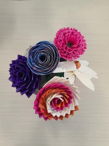 birds eye view of purple, pink, and multi-colored flowers made from duct tape