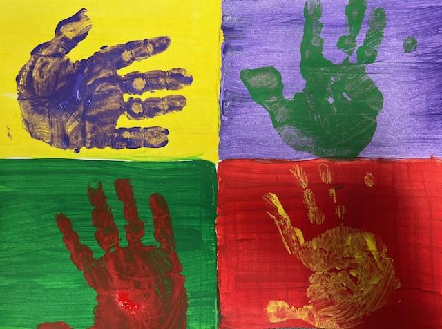 A painting of four different color rectangles with contrast painted hand prints in each one.